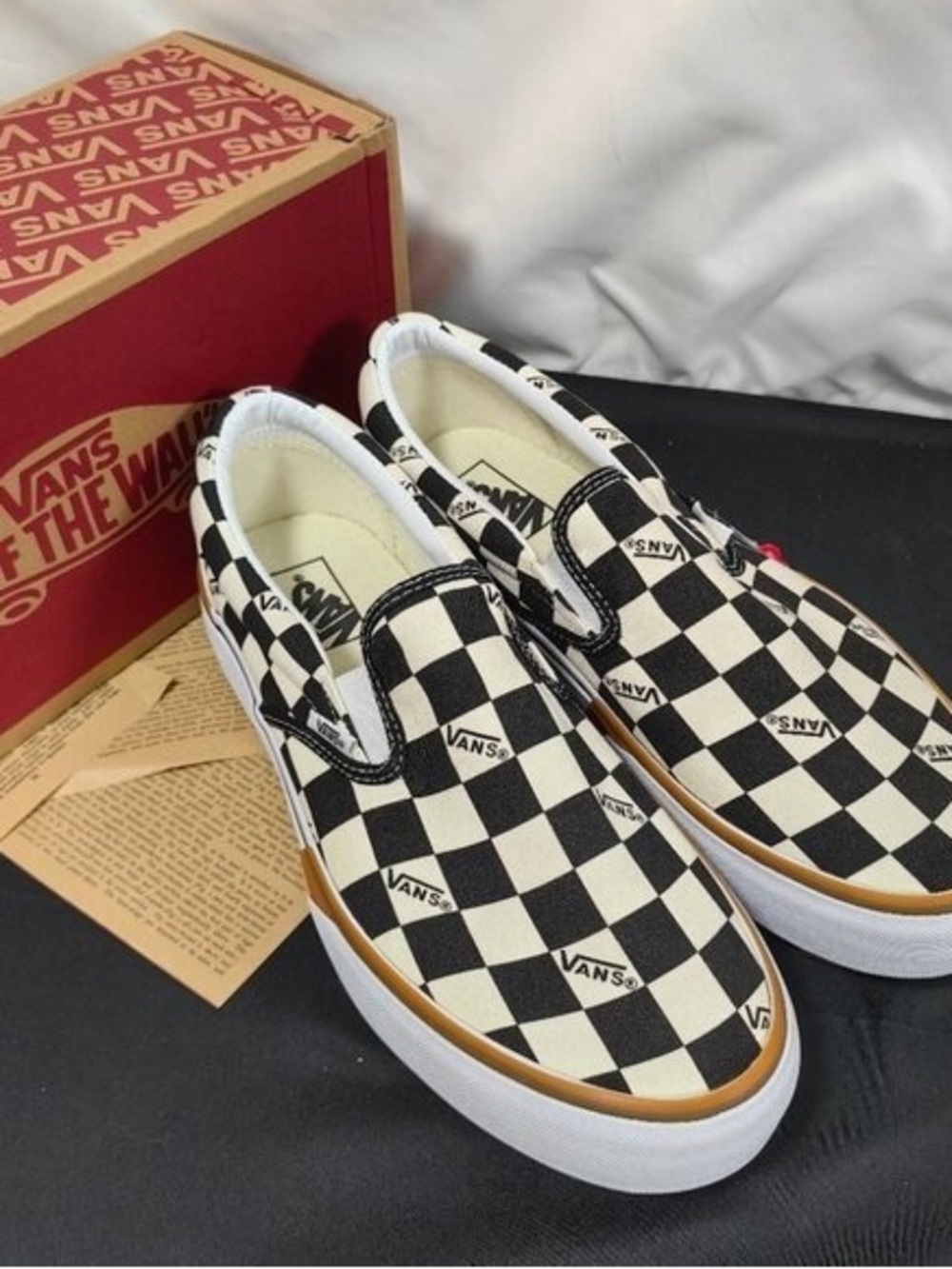Vans Checkerboard Slip-On Sneakers in Black, White and Gum